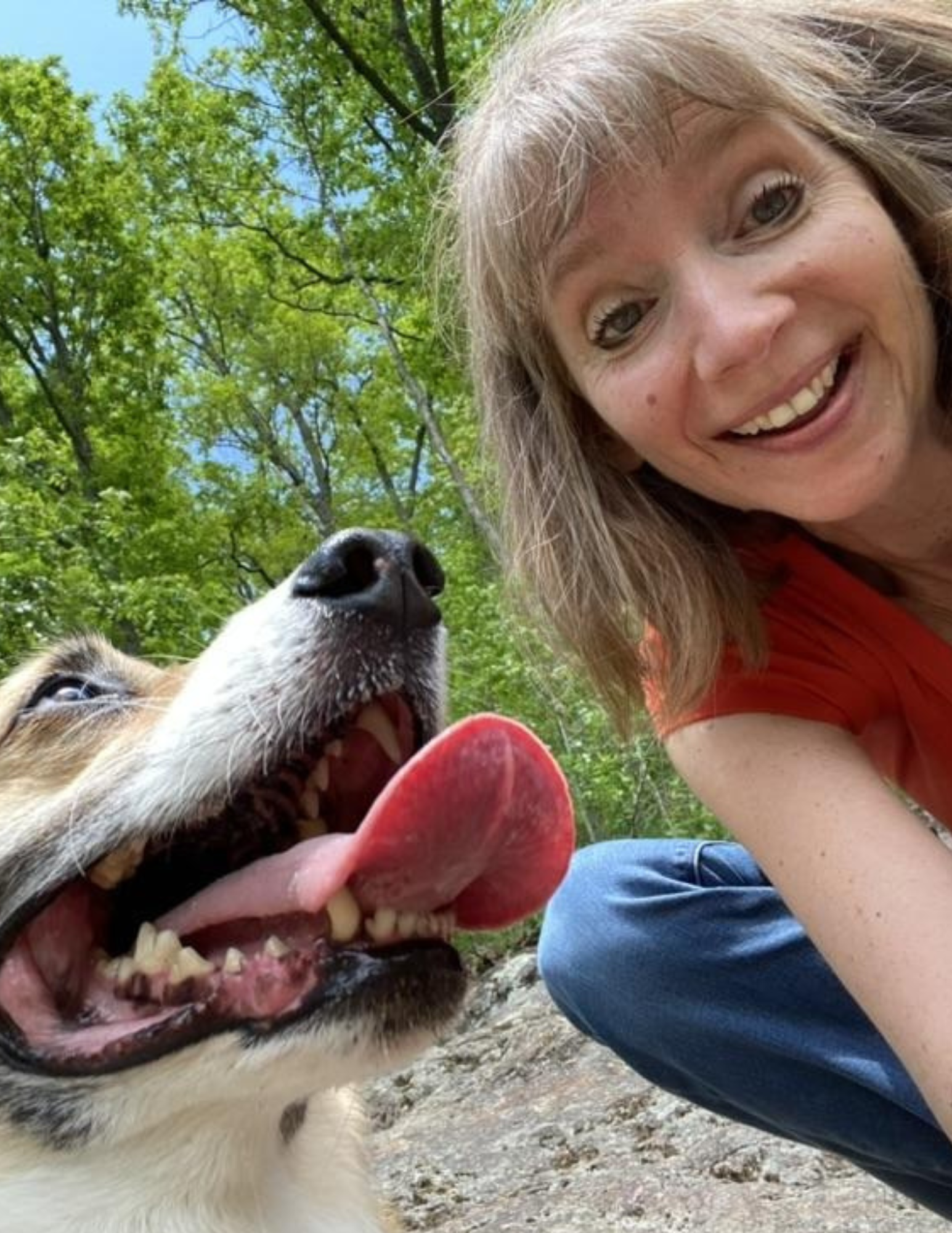 Kris with her dog outdoors